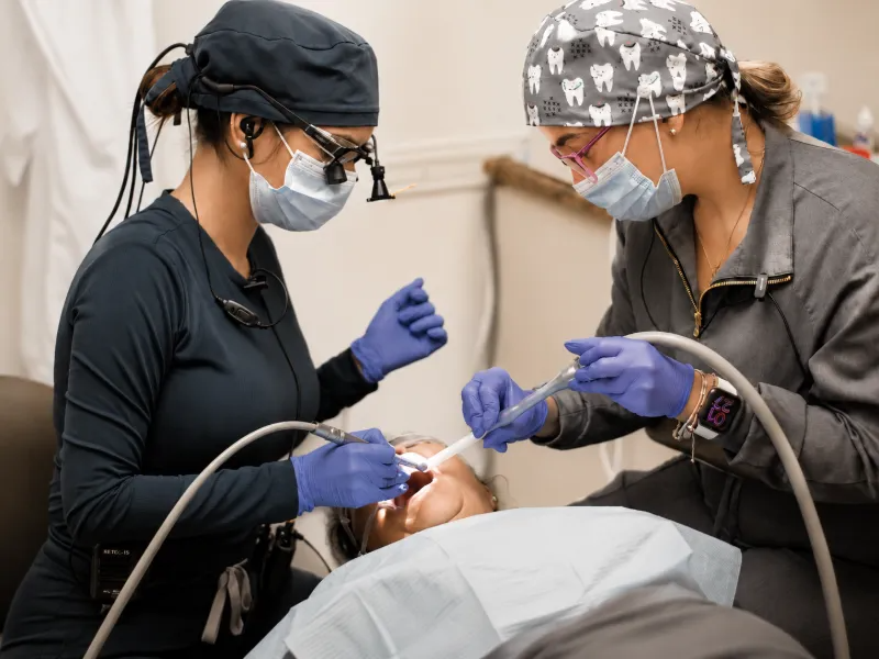 Dental practitioners providing care to a patient